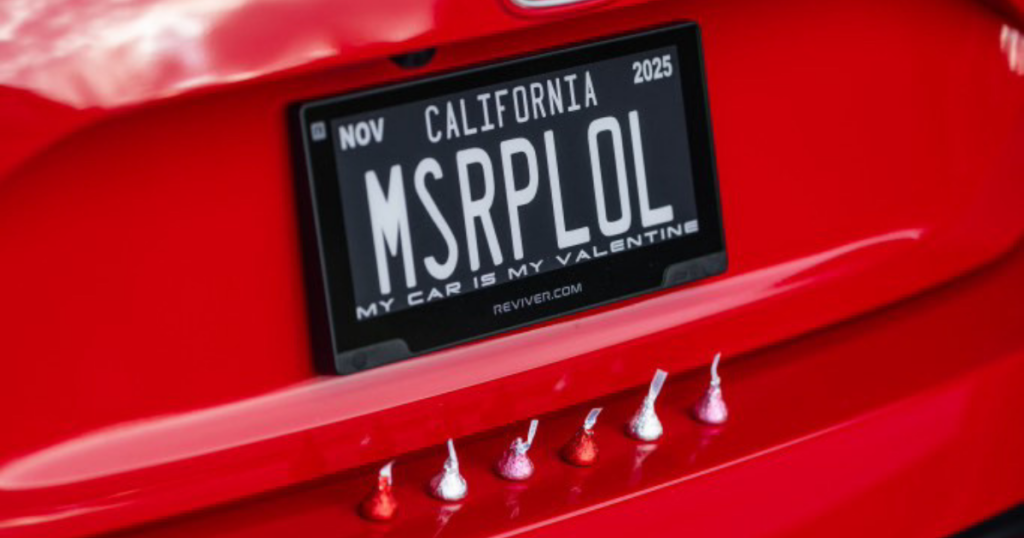 Your Guide to Digital License Plate Banner Messages 2 Image of a Red car with a digital license plate that reads "My Car is My Valentine" underneath their plate number.